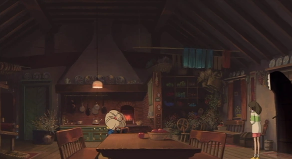 The warm, simple, handcrafted interior of Zeniba's cottage, centered around a fireplace.